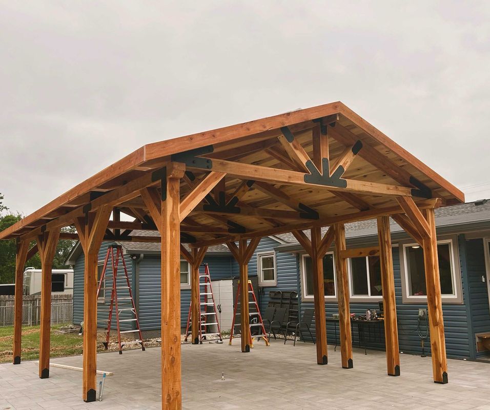 Timber pavilion built by Genesis Builders beside a Middle Tennessee home